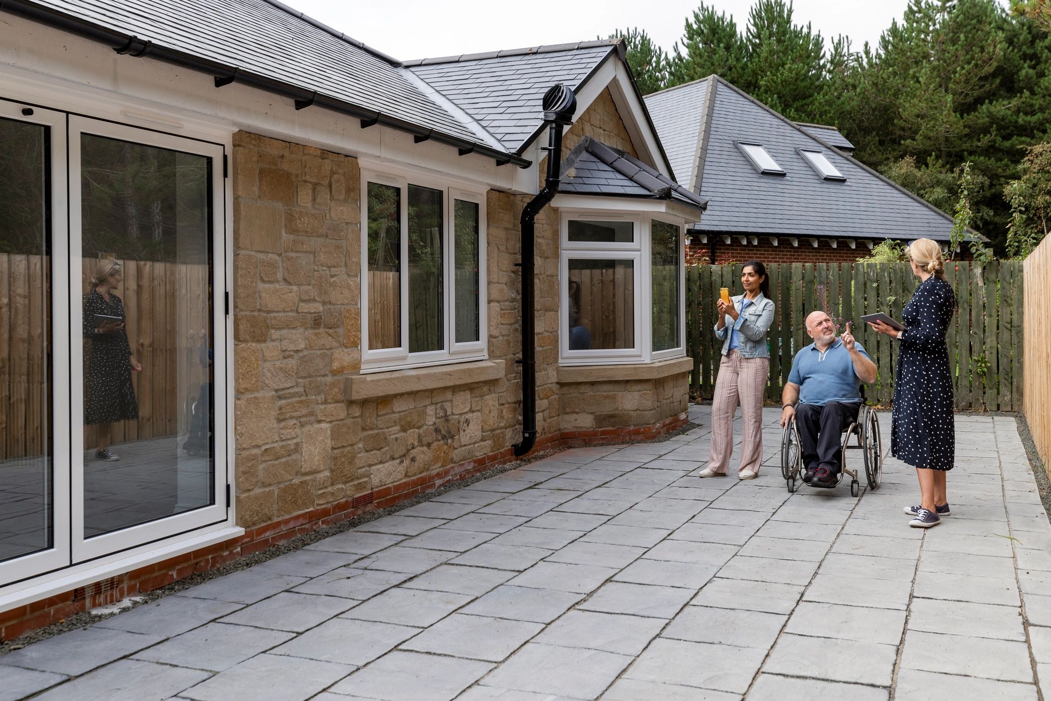 Accessible home visit with a wheelchair user and support professional