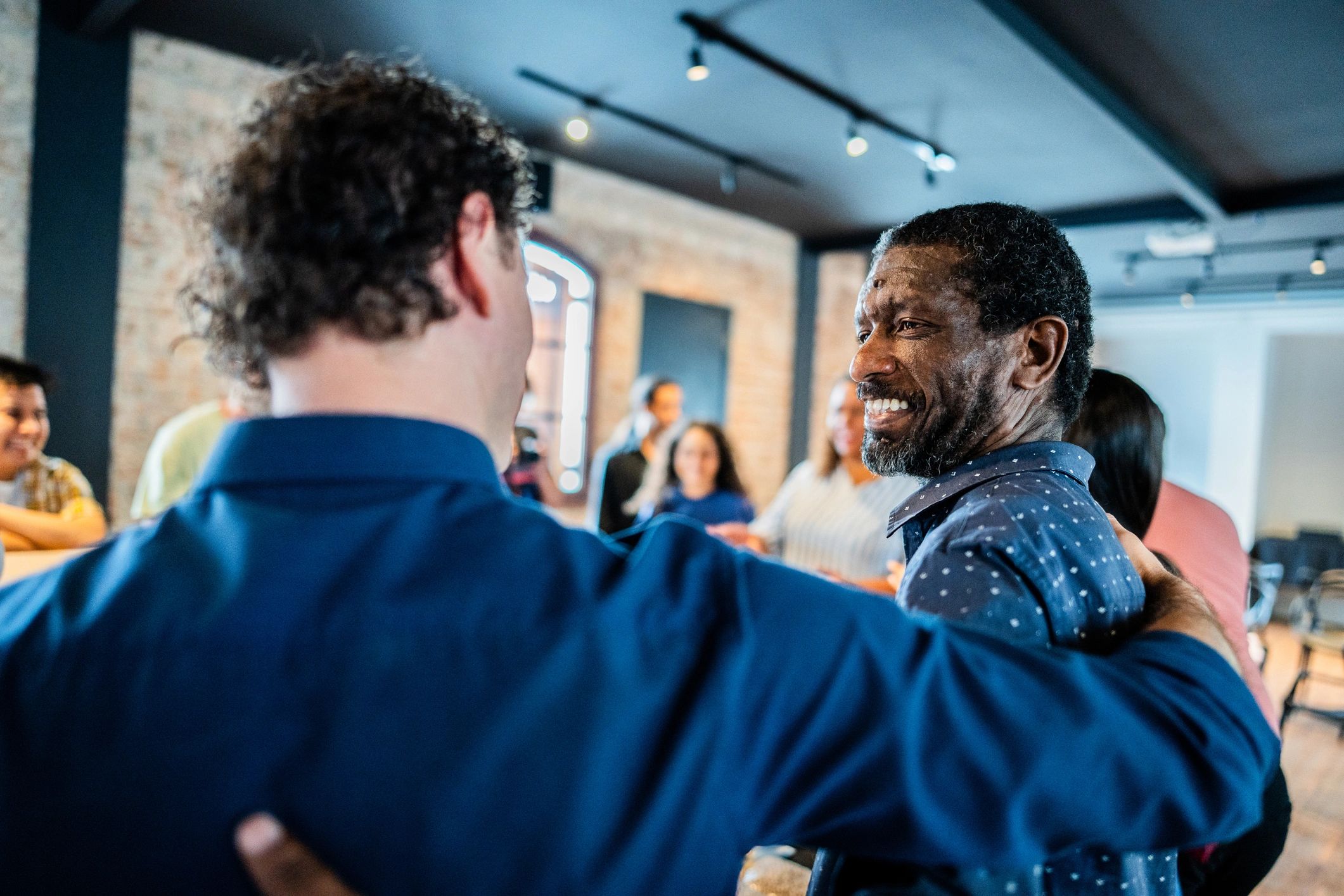 Community support workers sharing a positive moment